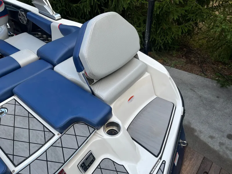 Slide: The Image of 2015 MasterCraft X20 boat with blue and white seating. - 22