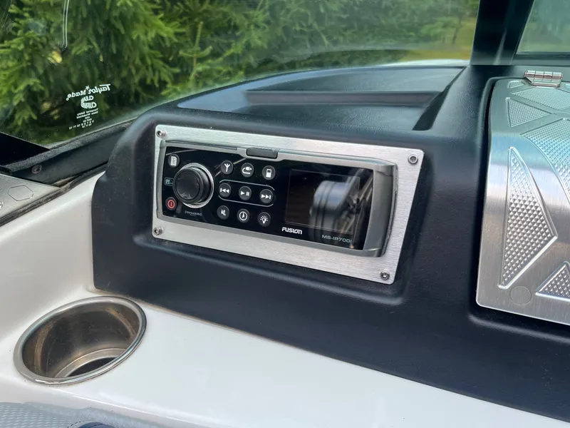 Slide: The Image of 2015 MasterCraft X20 boat dashboard with Fusion MS-IP700i radio. - 29