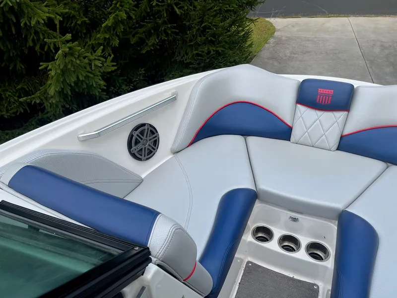 Slide: The Image of Interior of a 2015 MasterCraft X20 boat with blue and white seating. - 37