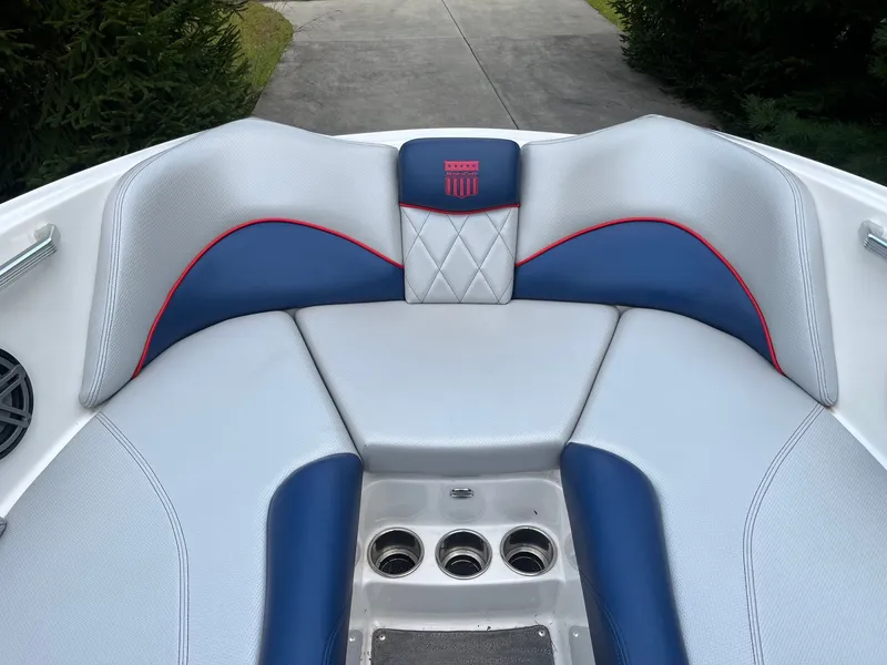 Slide: The Image of MasterCraft X20 2015 boat seating with blue and gray upholstery. - 38