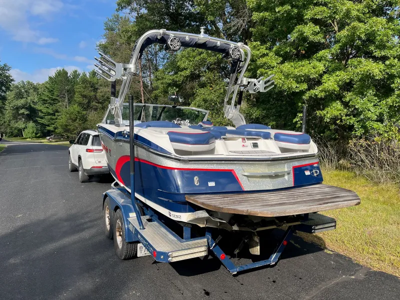 Slide: The Image of 2015 MasterCraft X20 boat on trailer, parked outdoors. - 9