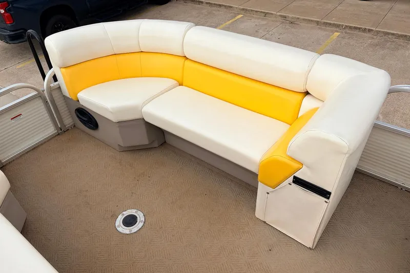 Slide: The Image of 2008 Sun Tracker Party Barge 21 Signature Series seating with yellow and white upholstery. - 12