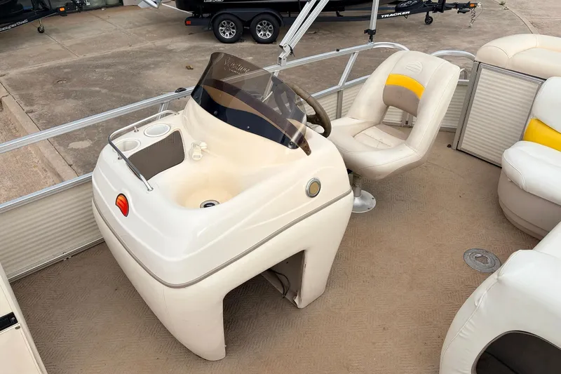 Slide: The Image of 2008 Sun Tracker Party Barge 21 Signature Series helm with captain's chair and console. - 13