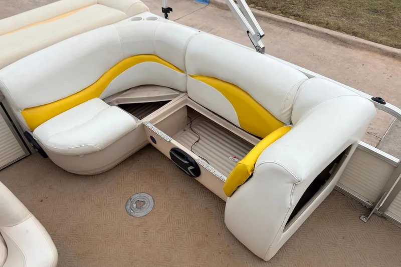 Slide: The Image of 2008 Sun Tracker Party Barge 21 Signature Series seating with yellow and white upholstery. - 21