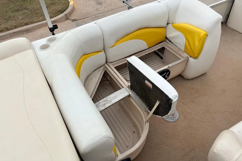 Slide: The Image of 2008 Sun Tracker Party Barge 21 Signature Series seating with storage compartments open. - 22