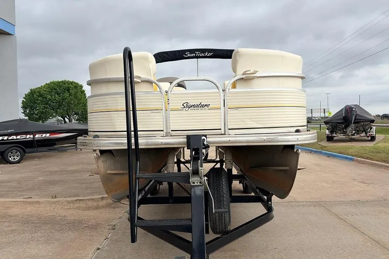 Slide: The Image of 2008 Sun Tracker Party Barge 21 Signature Series on trailer, parked outdoors. - 3