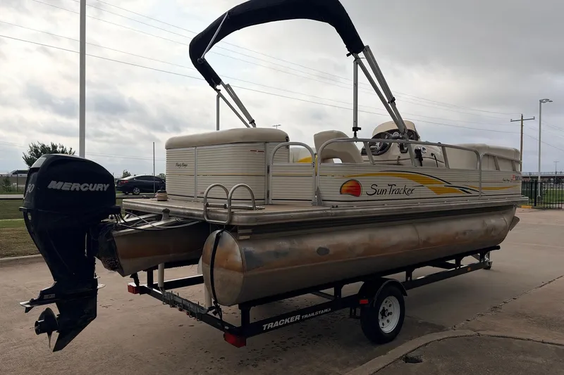 Slide: The Image of 2008 Sun Tracker Party Barge 21 Signature Series pontoon boat on trailer with Mercury outboard motor. - 6