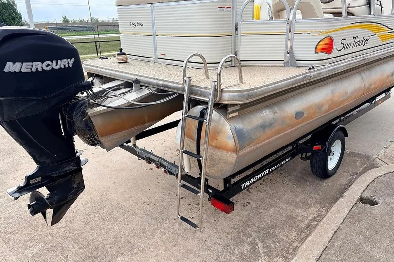 Slide: The Image of 2008 Sun Tracker Party Barge 21 Signature Series with Mercury outboard motor on trailer. - 9
