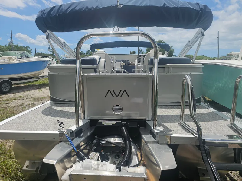 Slide: The Image of Avalon LSZ 2185 Quad Lounger 2026 on a sunny boat dock. - 14