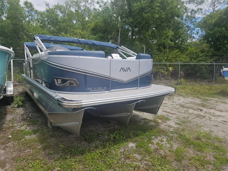Slide: The Image of 2026 Avalon LSZ 2185 Quad Lounger pontoon boat parked outdoors. - 21