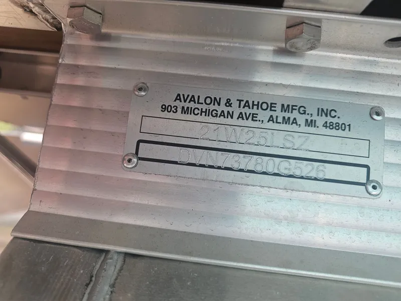 Slide: The Image of Metal plate from Avalon & Tahoe MFG, Inc. with serial number. - 26