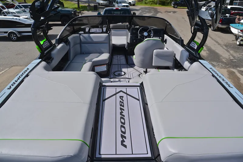 Slide: The Image of 2024 Moomba Mondo boat interior with spacious seating and modern dashboard design. - 18