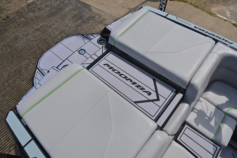Slide: The Image of 2024 Moomba Mondo boat interior with sleek gray seating and modern design. - 23