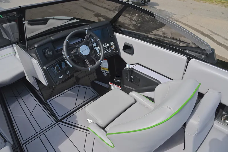 Slide: The Image of 2024 Moomba Mondo boat interior with sleek dashboard and modern steering wheel design. - 24