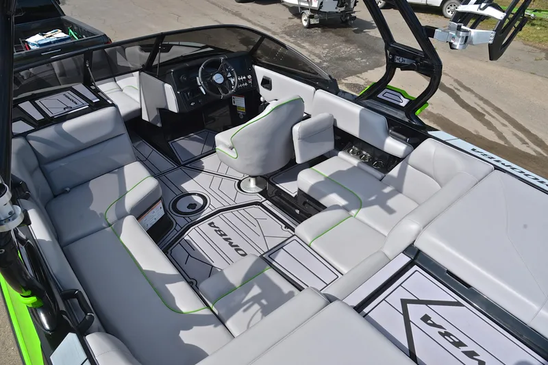 Slide: The Image of 2024 Moomba Mondo boat interior with modern seating and sleek dashboard design. - 25