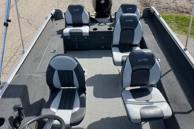 Slide: The Image of 2011 Lund 1875 Impact SS boat interior with four seats and steering wheel. - 11