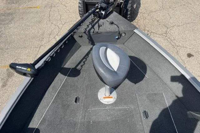 Slide: The Image of 2011 Lund 1875 Impact SS boat deck with seat and trolling motor. - 16