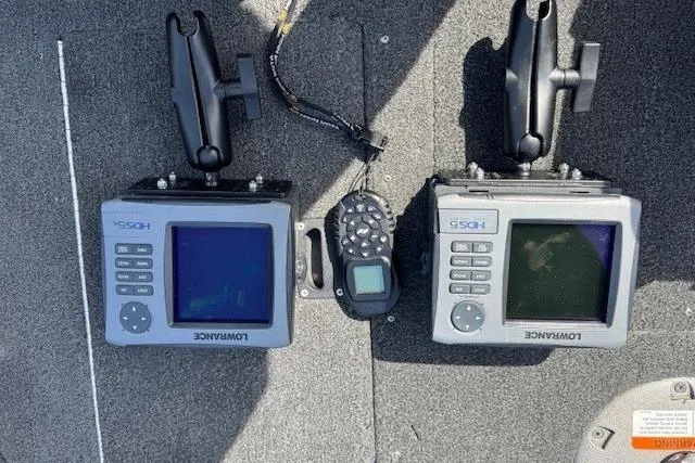 Slide: The Image of Dual Lowrance fish finders on a 2011 Lund 1875 Impact SS boat dashboard. - 19