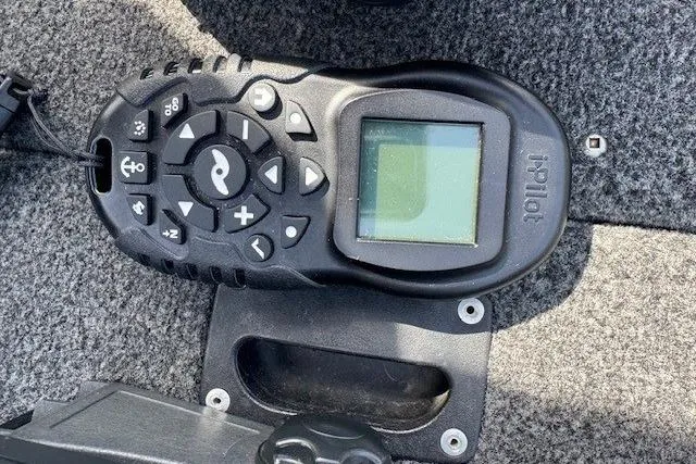 Slide: The Image of Remote control for iPilot system on 2011 Lund 1875 Impact SS boat. - 21