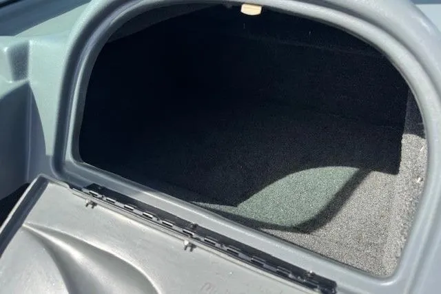 Slide: The Image of Storage compartment of a 2011 Lund 1875 Impact SS boat, open and empty. - 23