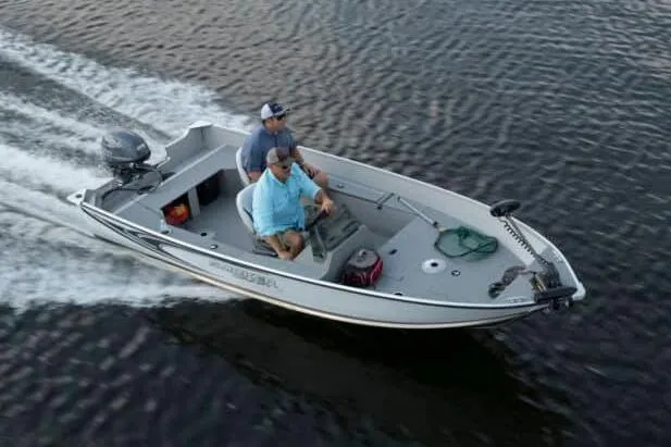 Slide: The Image of Manufacturer Provided Image: 2026 Smoker Craft Angler 16 SC boat with two people cruising on water. - 20