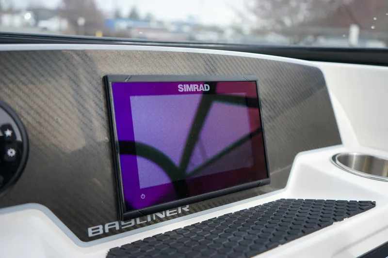 Slide: The Image of Simrad display on 2020 Bayliner DX 2200 dashboard with carbon fiber finish. - 11