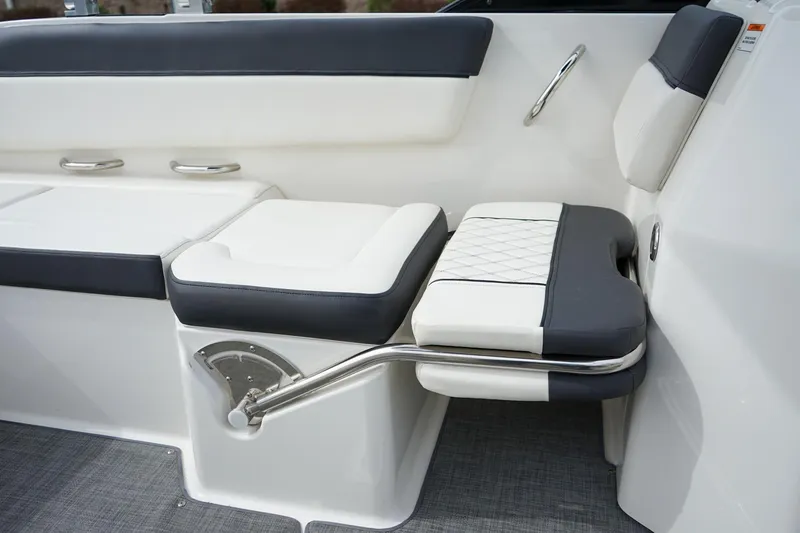 Slide: The Image of 2020 Bayliner DX 2200 boat interior seating with white and gray upholstery. - 12
