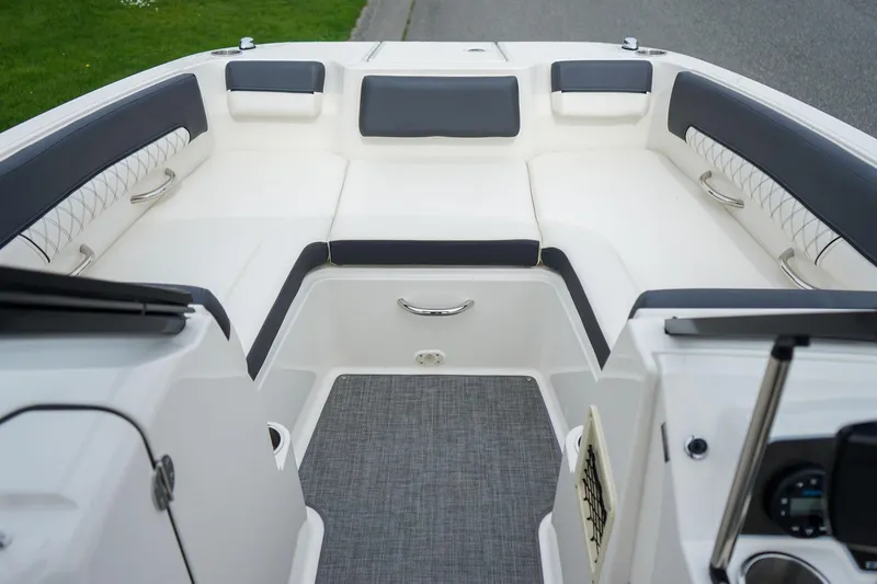 Slide: The Image of Interior view of 2020 Bayliner DX 2200 boat, featuring spacious seating and modern design. - 17
