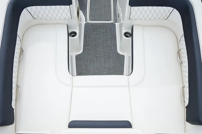Slide: The Image of Interior seating of 2020 Bayliner DX 2200 boat with white and gray upholstery. - 18