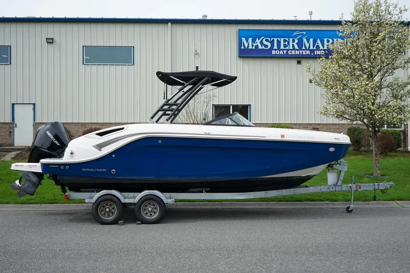 Slide: The Image of 2020 Bayliner DX 2200 boat on trailer outside Master Marine Boat Center. - 3