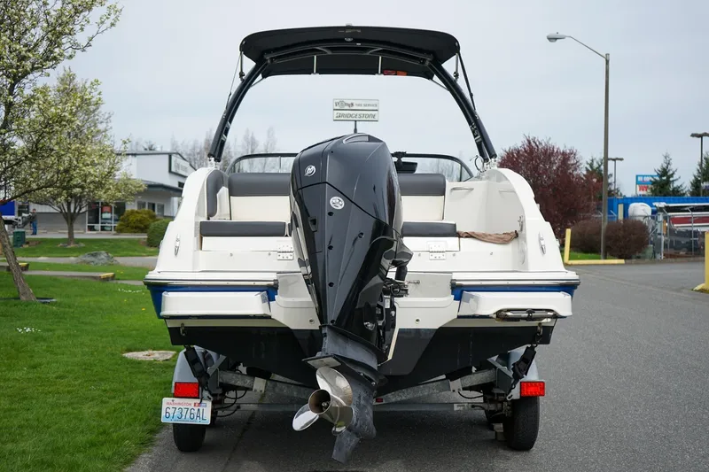 Slide: The Image of 2020 Bayliner DX 2200 boat on trailer, rear view with outboard motor. - 5