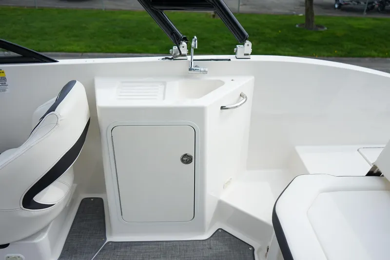 Slide: The Image of Bayliner DX 2200 boat interior with sink and seating, 2020 model. - 8