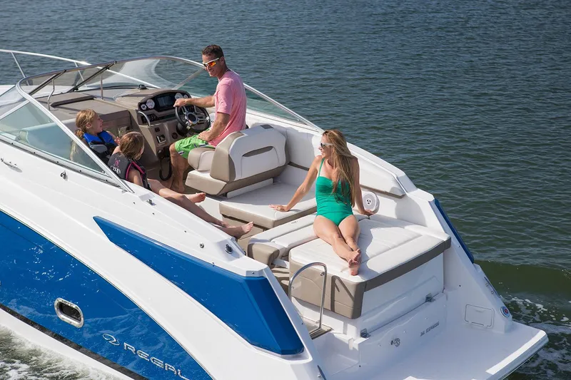 Slide: The Image of Manufacturer Provided Image: 2025 Regal 26 Express boat cruising with passengers on a sunny day. - 4