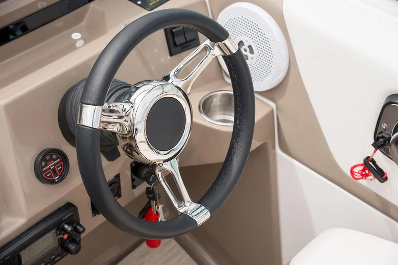 Slide: The Image of Manufacturer Provided Image: Steering wheel of 2025 Regal 26 Express boat, featuring modern controls and speaker. - 5