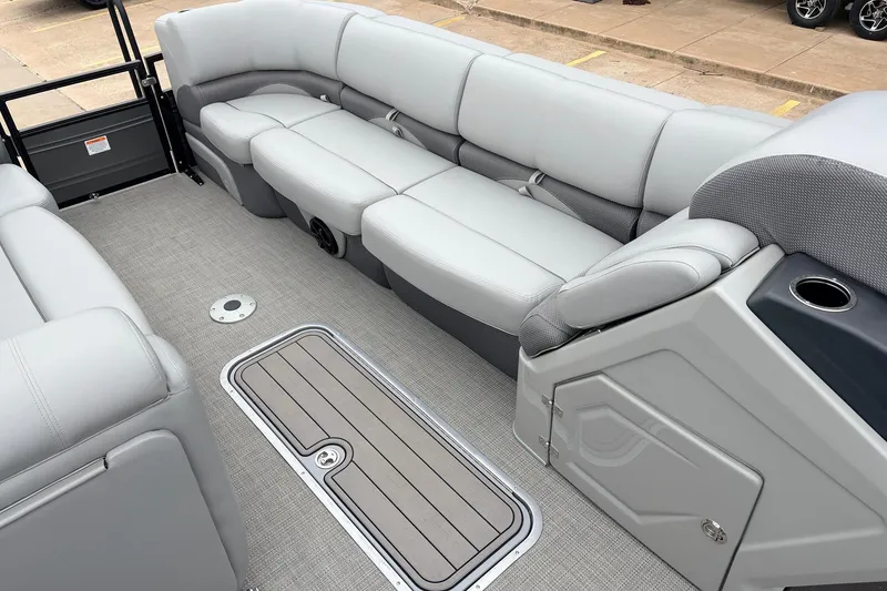 Slide: The Image of Interior of 2022 Regency 250 DL3 pontoon boat with gray seating and flooring. - 19