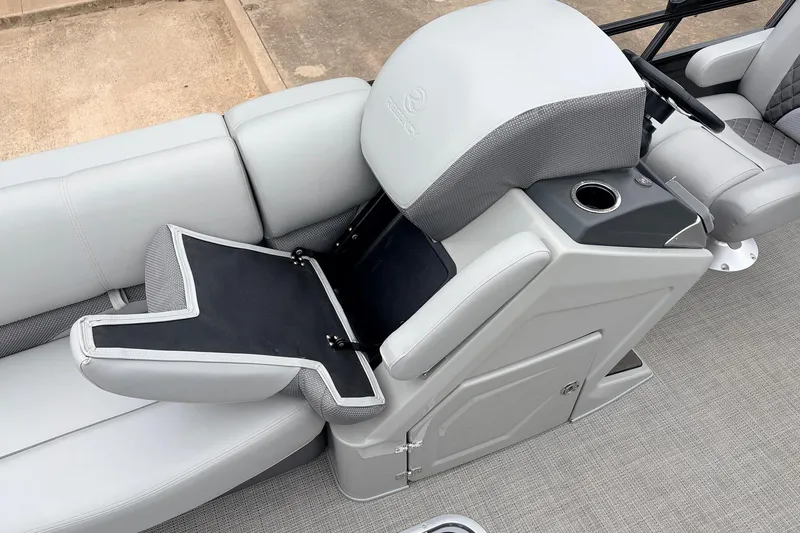Slide: The Image of 2022 Regency 250 DL3 boat interior with gray seating and storage compartment. - 20