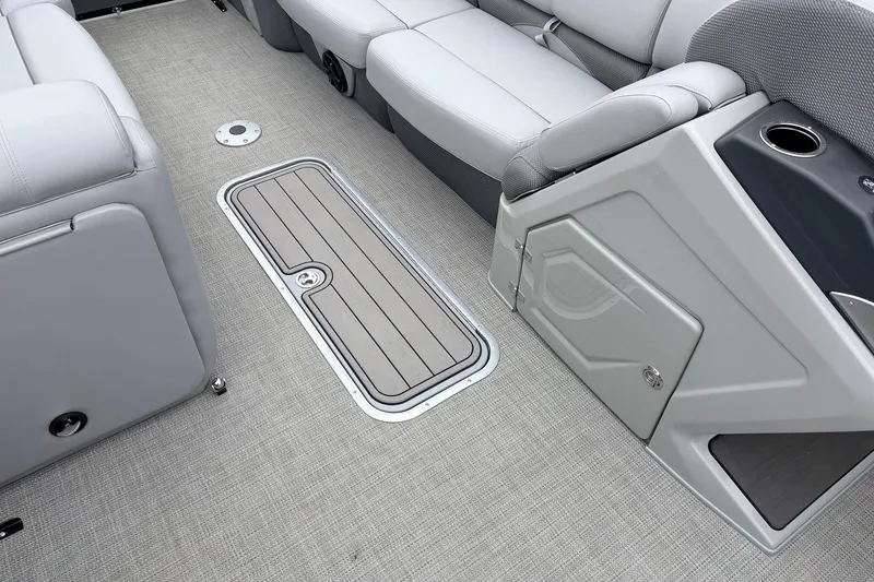 Slide: The Image of Interior of 2022 Regency 250 DL3 boat with gray seating and storage compartment. - 28