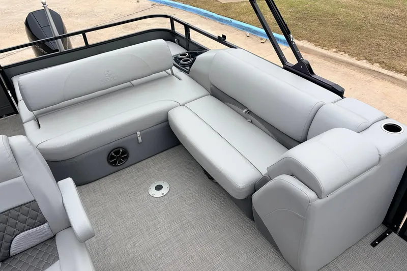Slide: The Image of Luxurious seating on 2022 Regency 250 DL3 pontoon boat with gray upholstery and cup holders. - 39