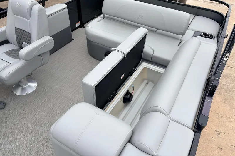 Slide: The Image of 2022 Regency 250 DL3 boat interior with gray seating and storage compartment. - 41