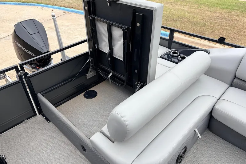 Slide: The Image of 2022 Regency 250 DL3 boat interior with seating and Mercury engine. - 48