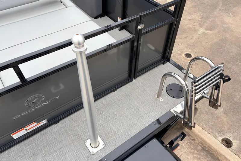 Slide: The Image of 2022 Regency 250 DL3 boat deck with ladder and railing details. - 50
