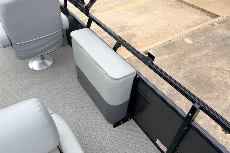 Slide: The Image of 2022 Regency 250 DL3 boat interior with gray seating and flooring, showcasing modern design. - 53