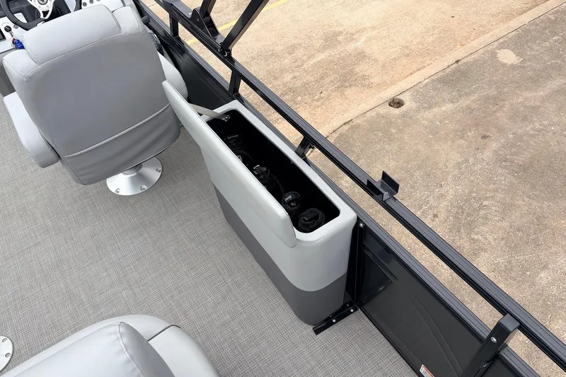 Slide: The Image of 2022 Regency 250 DL3 boat interior with gray seating and storage compartment. - 54