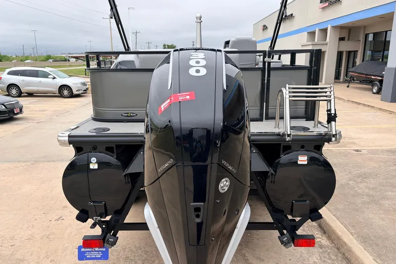 Slide: The Image of 2022 Regency 250 DL3 boat with powerful 300 Verado engine, parked at dealership. - 8