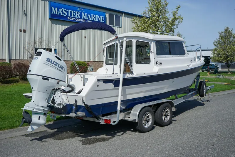 Slide: The Image of 2024 C-Dory 23' Venture Sport boat on trailer at Master Marine Boat Center. - 4