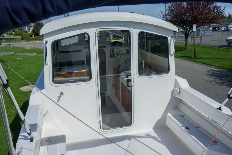 Slide: The Image of 2024 C-Dory 23' Venture Sport boat, rear view with cabin entrance. - 6