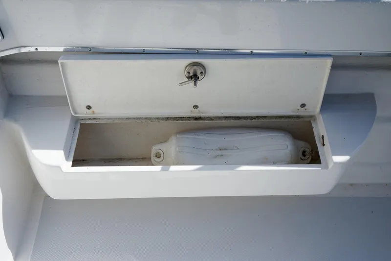 Slide: The Image of Open storage compartment on 2024 C-Dory 23' Venture Sport boat. - 9