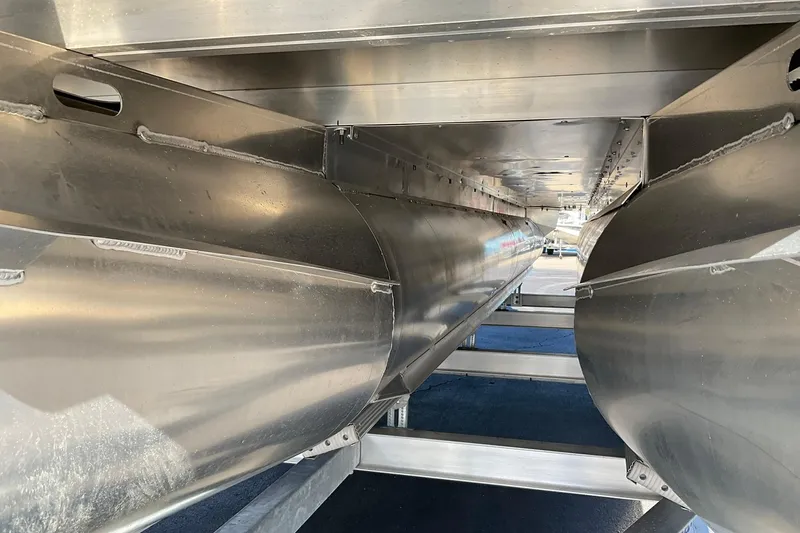 Slide: The Image of Underneath view of 2026 Crest Conquest 230 SLSC pontoon boat, showcasing aluminum structure. - 11