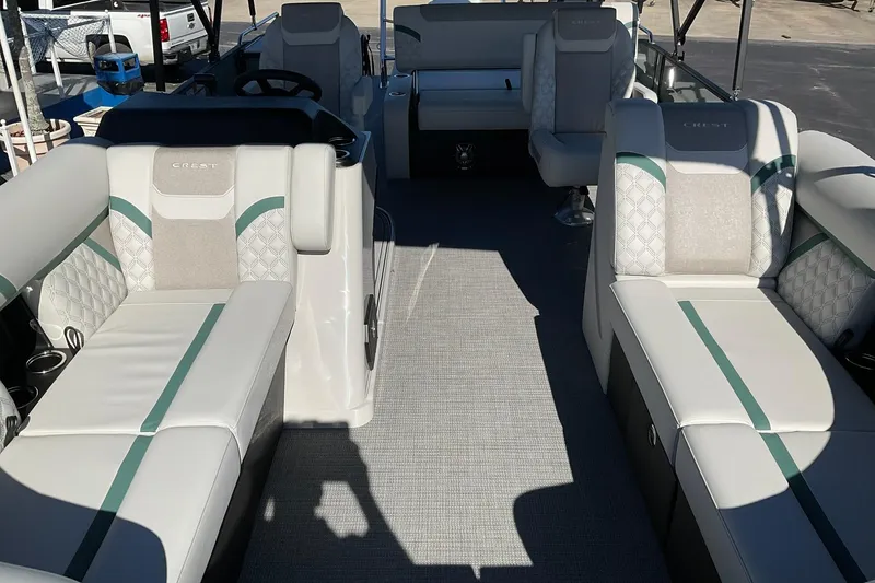 Slide: The Image of 2026 Crest Conquest 230 SLSC boat interior with luxurious seating and modern design. - 12