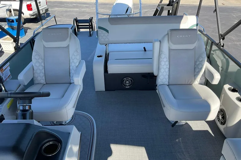 Slide: The Image of 2026 Crest Conquest 230 SLSC boat interior with luxurious seating and modern design. - 15